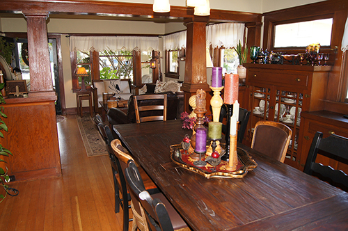 Tapered Craftsman pillars separate a living room and dining room.  Martinez, CA.